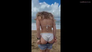 Dropping my shorts on the beach to flash some ass